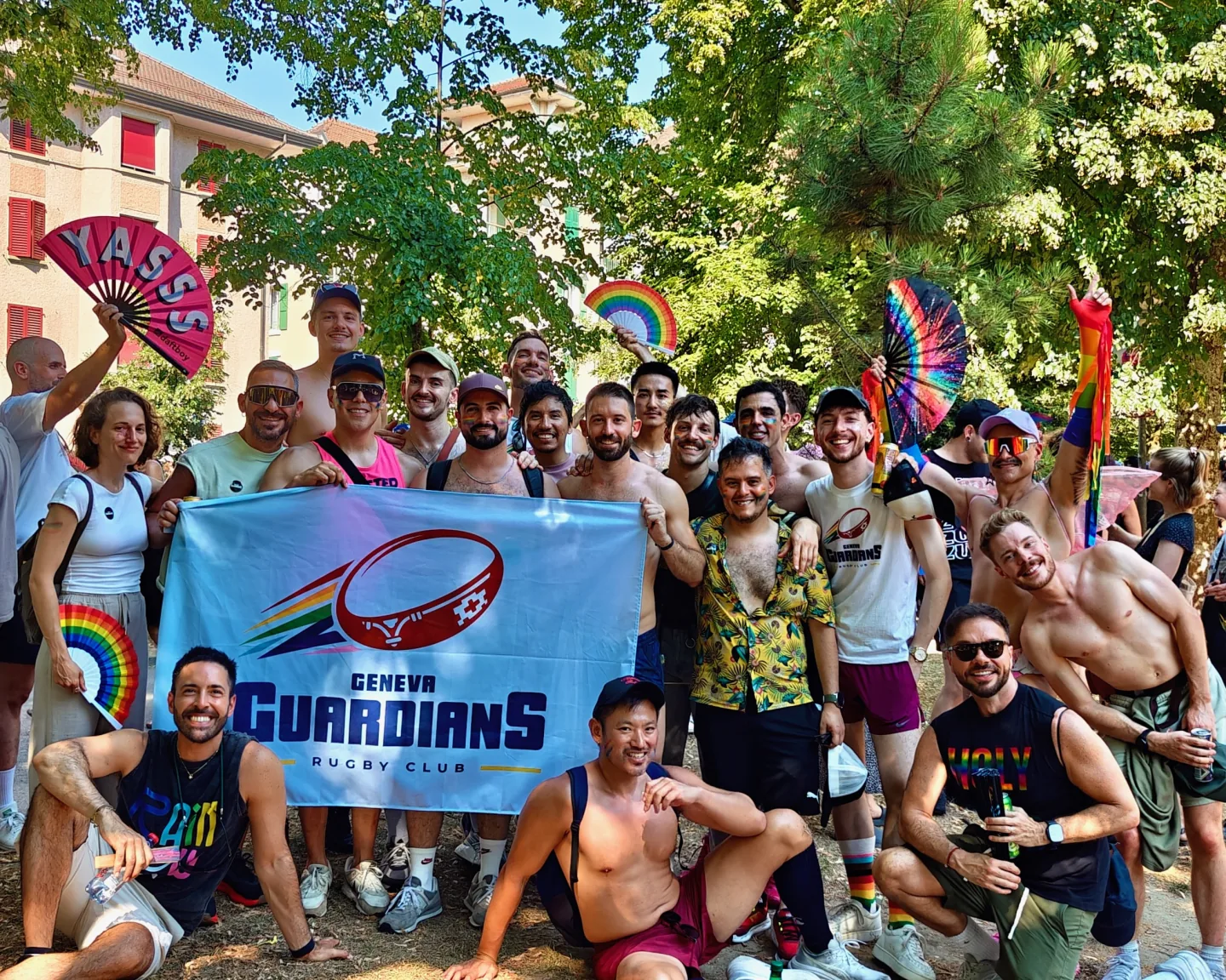 Guardians together with the club banner and rainbow flags and fans